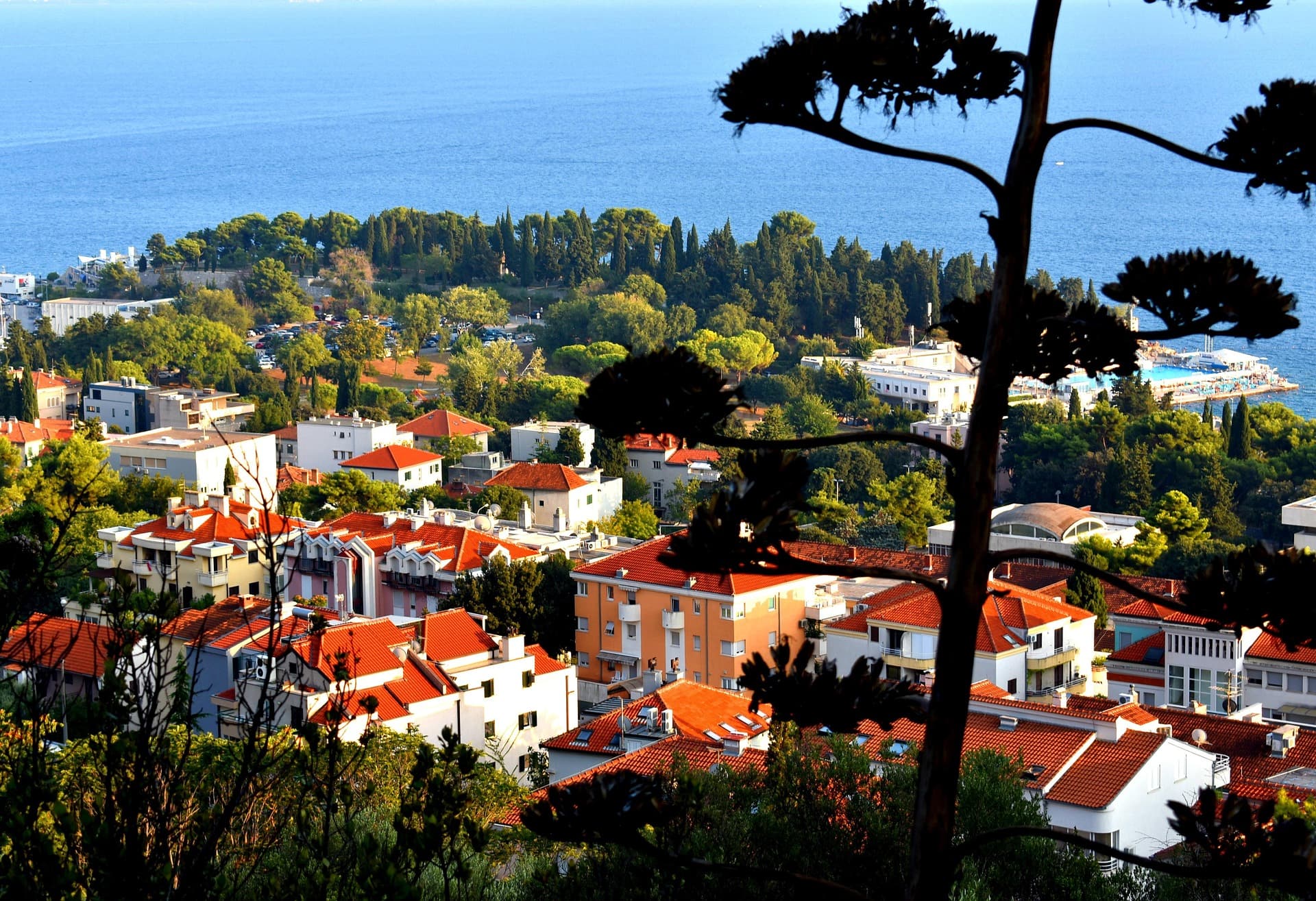 Split's seafront promenade in warm morning light, the old town rising behind